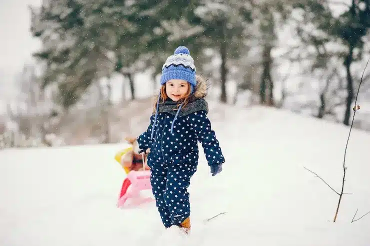 little girl blue hat playing win